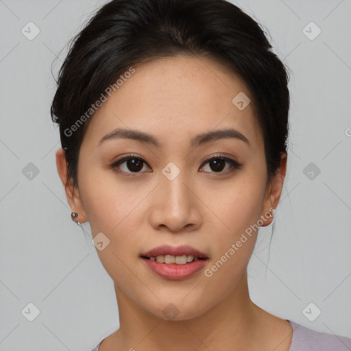 Joyful asian young-adult female with short  brown hair and brown eyes