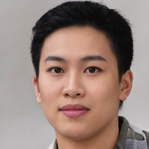 Joyful asian young-adult female with short  black hair and brown eyes