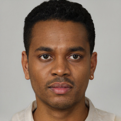 Neutral black young-adult male with short  black hair and brown eyes