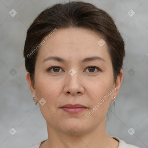 Joyful white adult female with short  brown hair and brown eyes