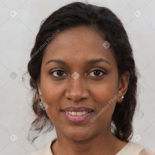 Joyful black adult female with medium  brown hair and brown eyes