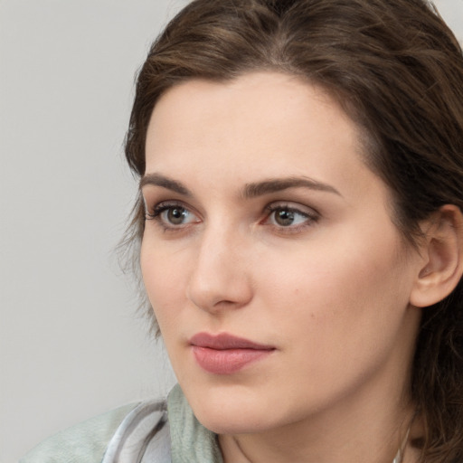 Neutral white young-adult female with medium  brown hair and brown eyes