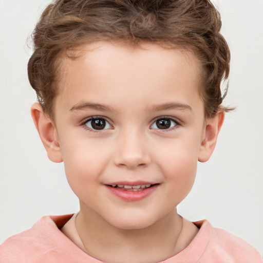 Joyful white child male with short  brown hair and brown eyes