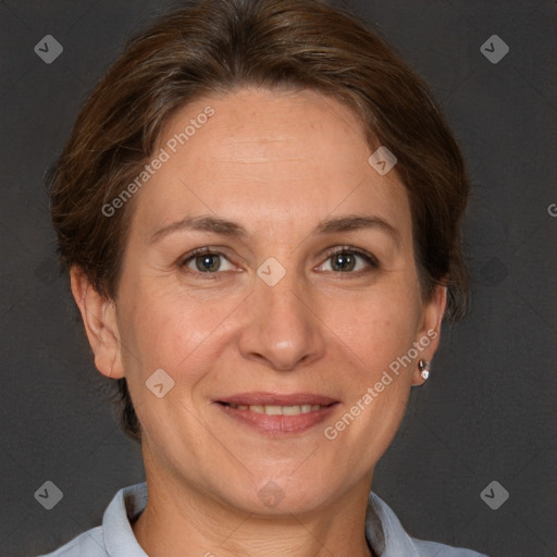 Joyful white adult female with short  brown hair and brown eyes