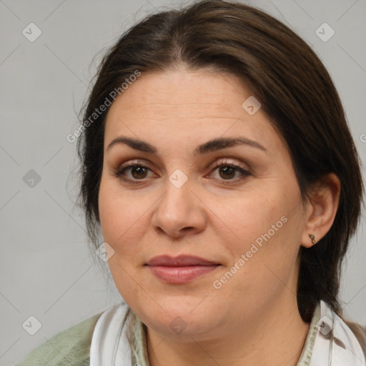 Joyful white adult female with medium  brown hair and brown eyes