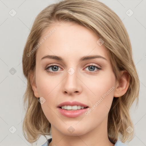 Joyful white young-adult female with medium  brown hair and blue eyes