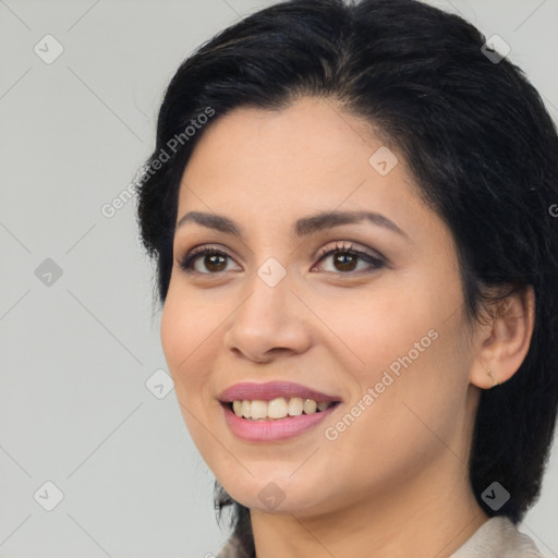 Joyful latino young-adult female with medium  black hair and brown eyes