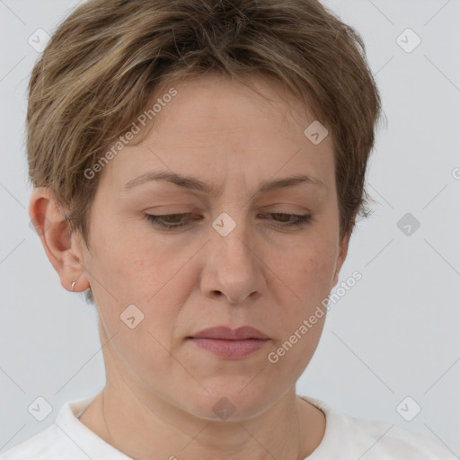 Joyful white adult female with short  brown hair and brown eyes