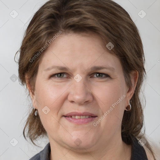 Joyful white adult female with medium  brown hair and grey eyes