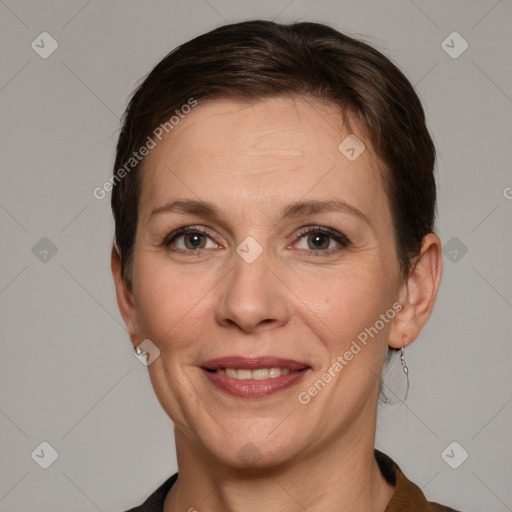 Joyful white adult female with short  brown hair and grey eyes