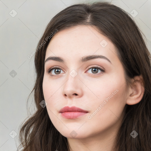 Neutral white young-adult female with long  brown hair and brown eyes