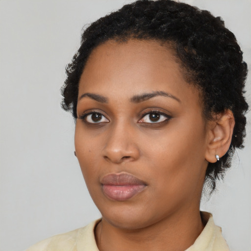 Neutral black young-adult female with short  black hair and brown eyes