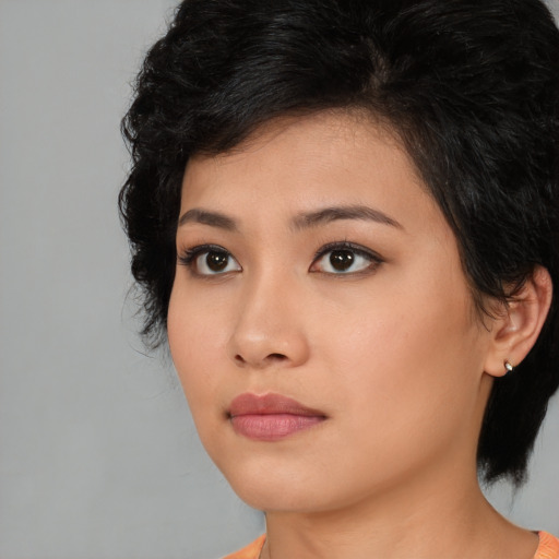 Neutral asian young-adult female with medium  black hair and brown eyes