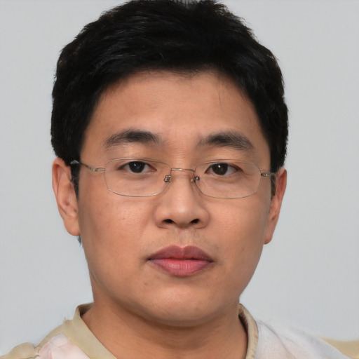 Neutral asian young-adult male with short  brown hair and brown eyes