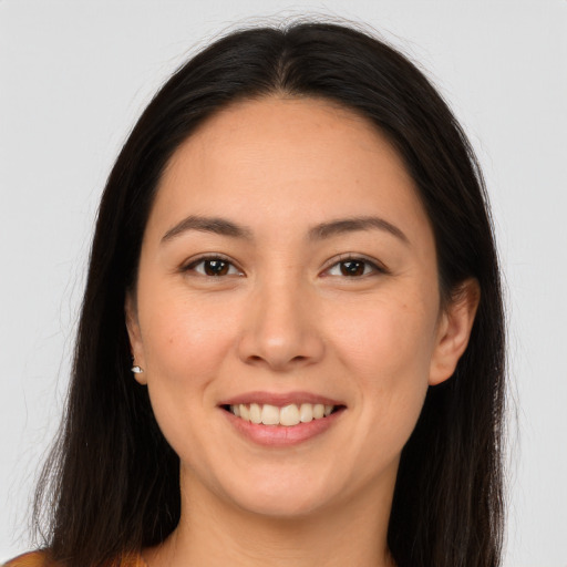 Joyful white young-adult female with long  brown hair and brown eyes