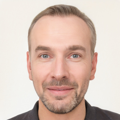 Joyful white adult male with short  brown hair and grey eyes