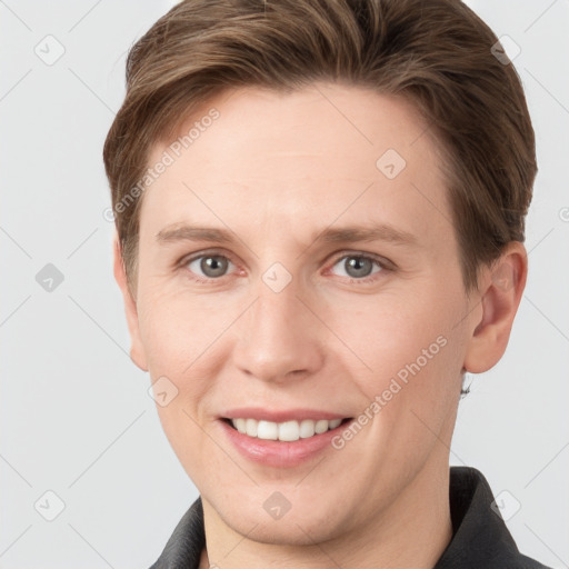 Joyful white young-adult female with short  brown hair and grey eyes