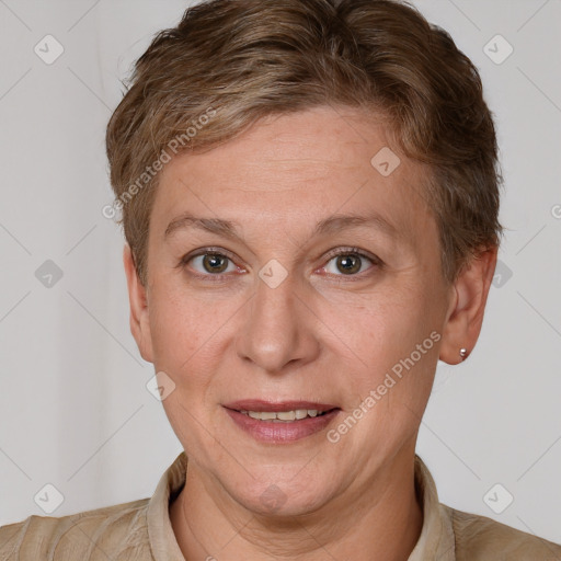 Joyful white adult female with short  brown hair and grey eyes