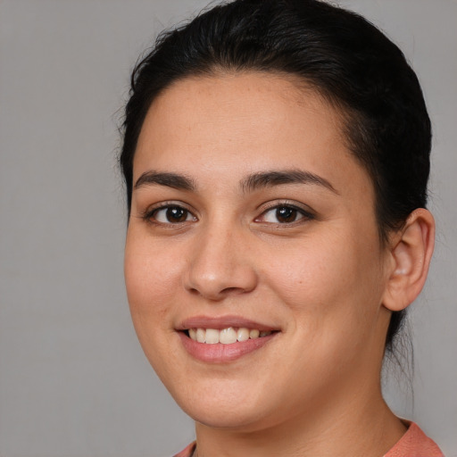 Joyful white young-adult female with medium  brown hair and brown eyes