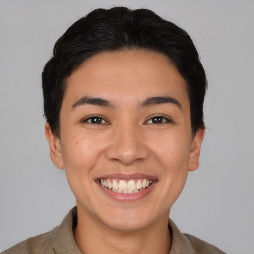 Joyful white young-adult female with short  black hair and brown eyes