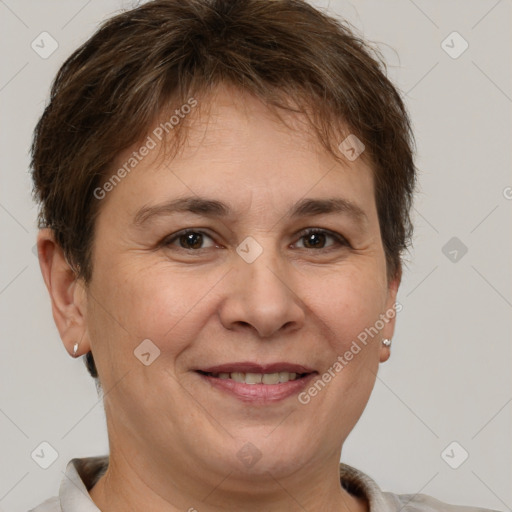 Joyful white adult female with short  brown hair and brown eyes