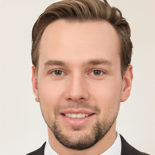 Joyful white young-adult male with short  brown hair and brown eyes