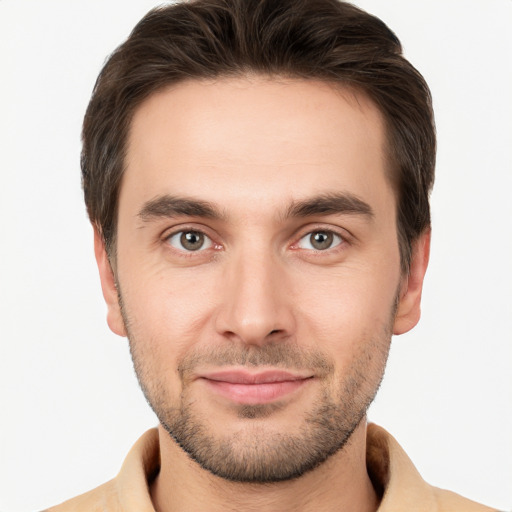 Joyful white young-adult male with short  brown hair and brown eyes