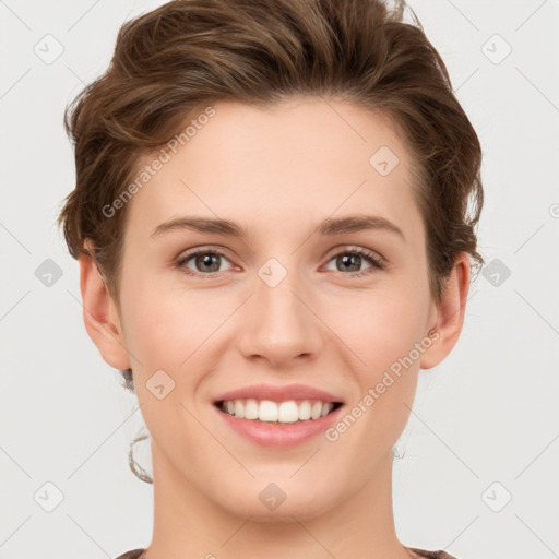 Joyful white young-adult female with short  brown hair and grey eyes