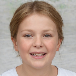 Joyful white child female with medium  brown hair and brown eyes