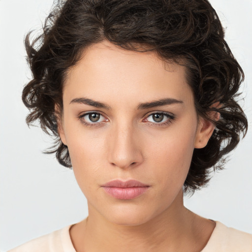 Neutral white young-adult female with medium  brown hair and brown eyes