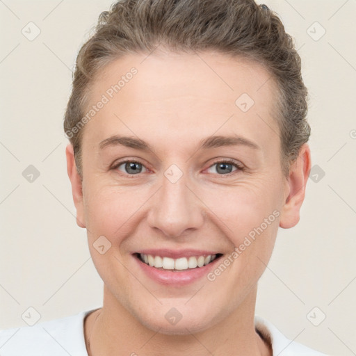 Joyful white young-adult female with short  brown hair and brown eyes