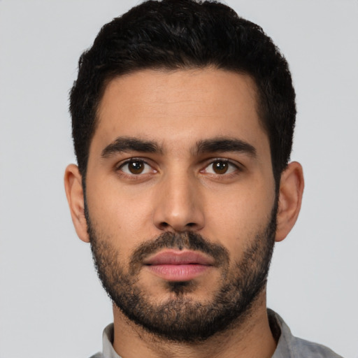 Neutral latino young-adult male with short  black hair and brown eyes