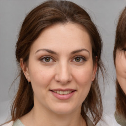 Joyful white young-adult female with medium  brown hair and brown eyes