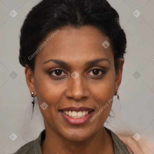 Joyful black young-adult female with short  black hair and brown eyes