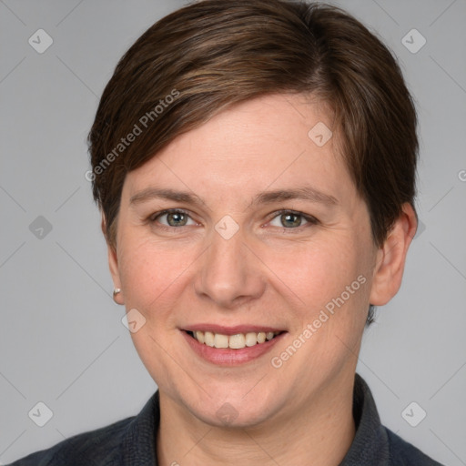 Joyful white adult female with short  brown hair and grey eyes