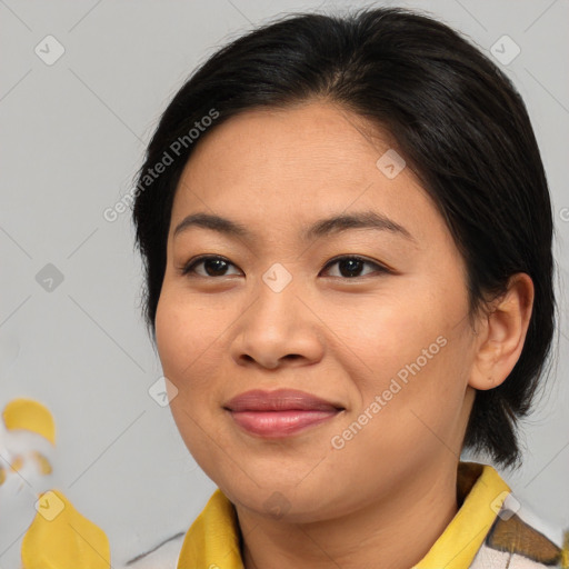 Joyful asian young-adult female with medium  brown hair and brown eyes