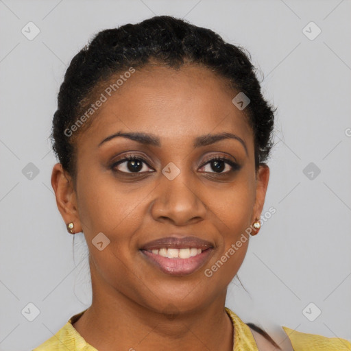 Joyful black young-adult female with short  black hair and brown eyes