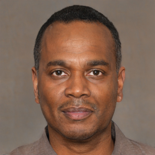 Neutral black adult male with short  black hair and brown eyes