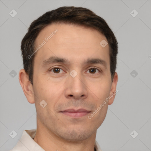 Joyful white adult male with short  brown hair and brown eyes