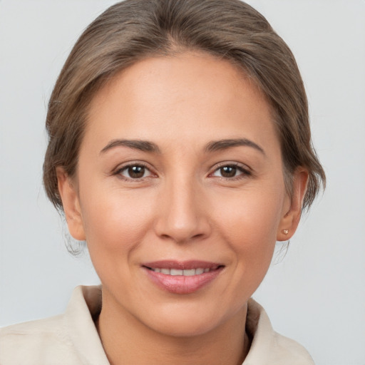 Joyful white young-adult female with medium  brown hair and brown eyes