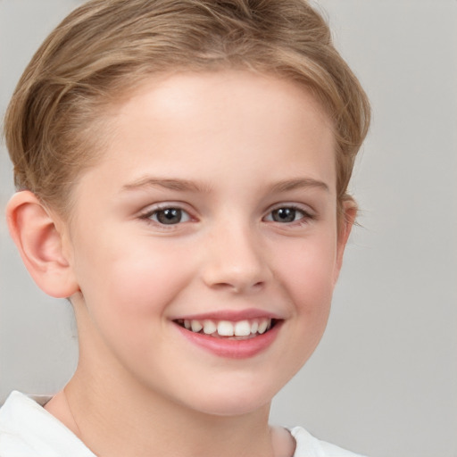 Joyful white child female with short  brown hair and brown eyes