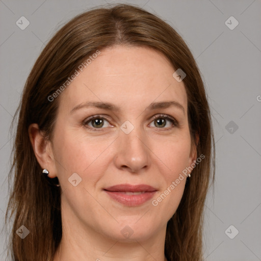 Joyful white adult female with long  brown hair and grey eyes