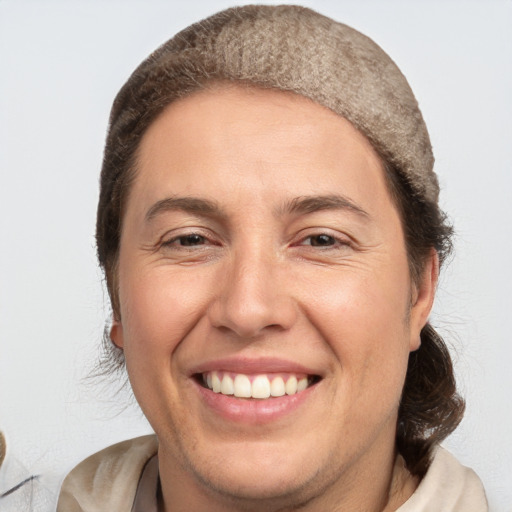 Joyful white adult female with short  brown hair and brown eyes