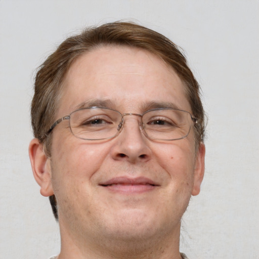 Joyful white adult male with short  brown hair and grey eyes