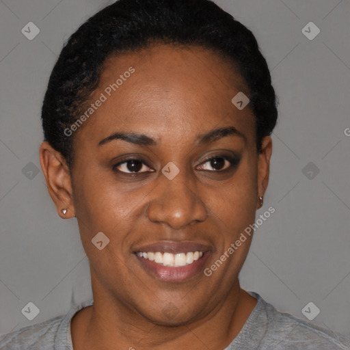 Joyful black young-adult female with short  black hair and brown eyes