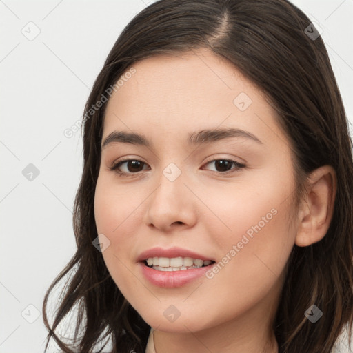 Joyful white young-adult female with long  brown hair and brown eyes