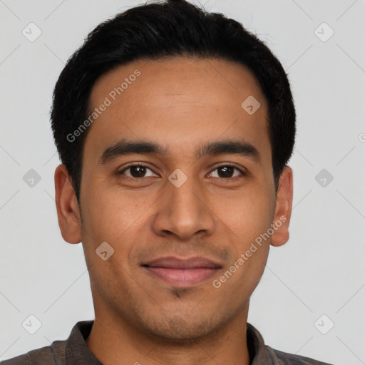 Joyful latino young-adult male with short  black hair and brown eyes