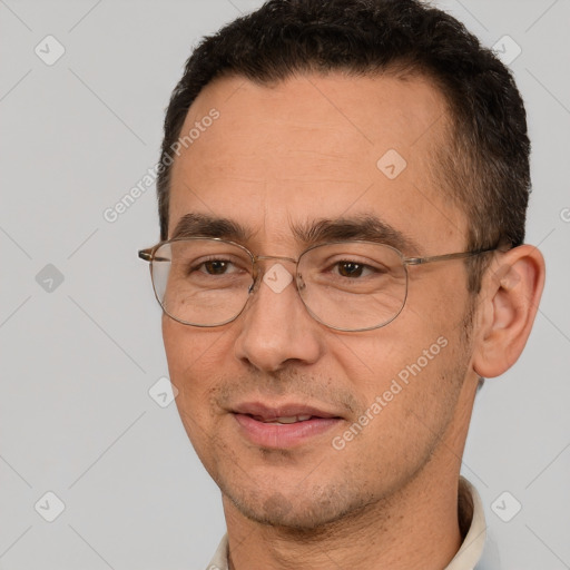 Joyful white adult male with short  brown hair and brown eyes