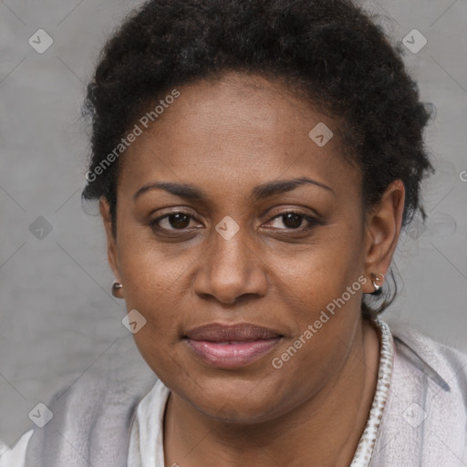 Joyful black adult female with short  brown hair and brown eyes