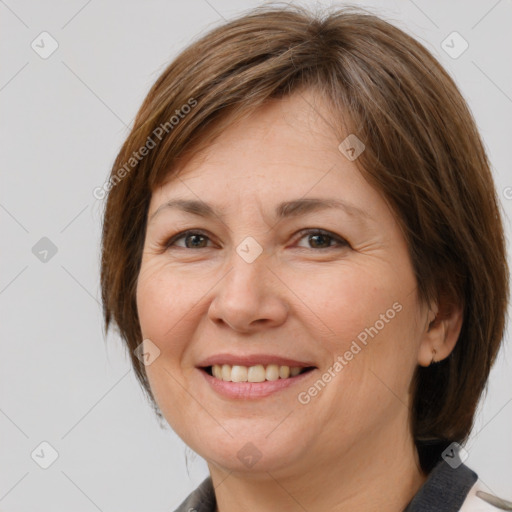 Joyful white adult female with medium  brown hair and brown eyes